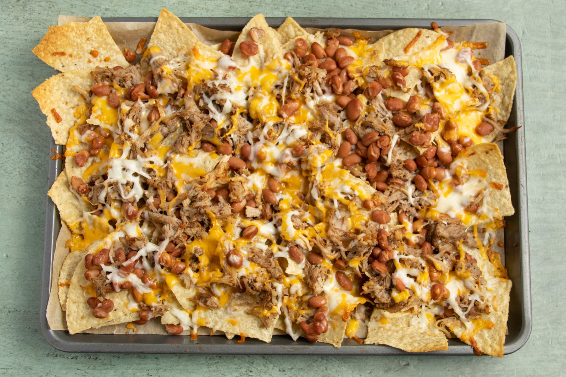 This is a picture of the carnitas nachos after baking.