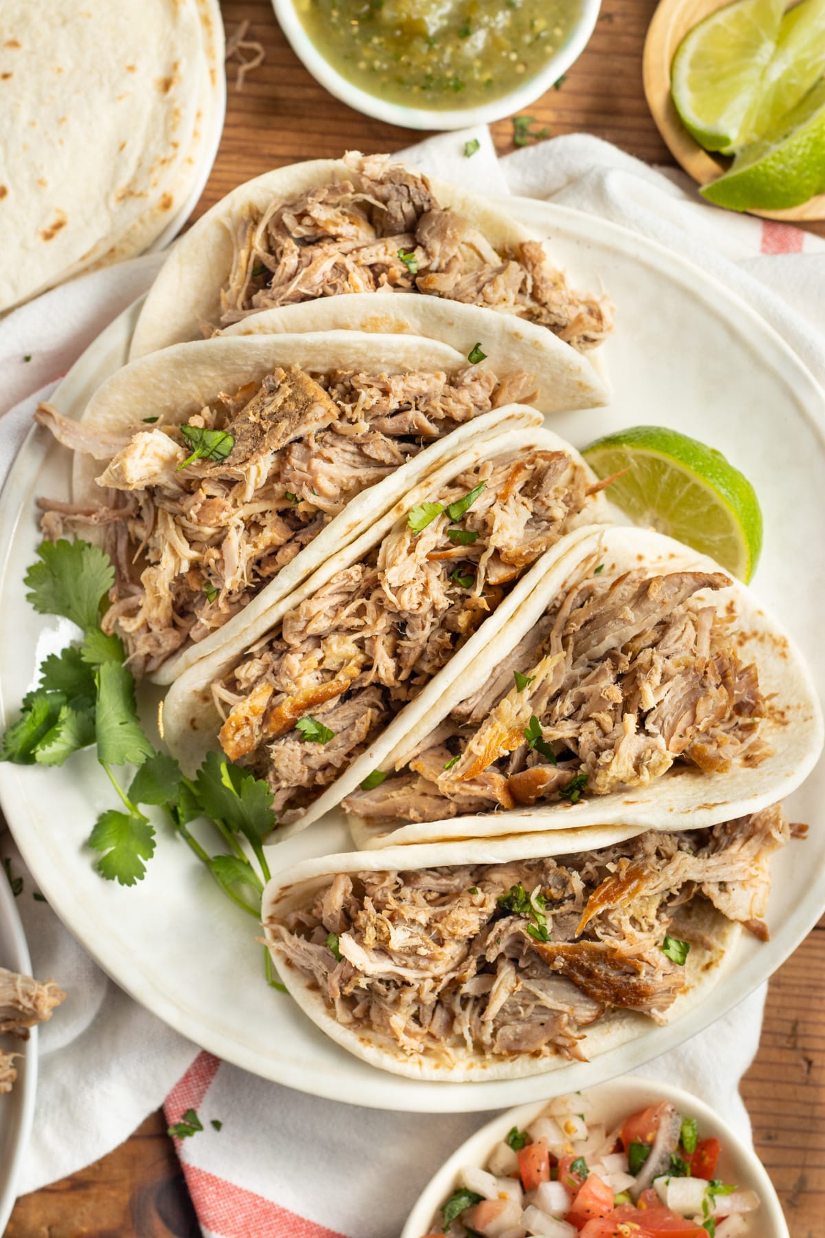 This is a picture of slow cooker carnitas in tacos.