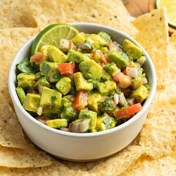 This is a square picture of avocado pico de gallo.