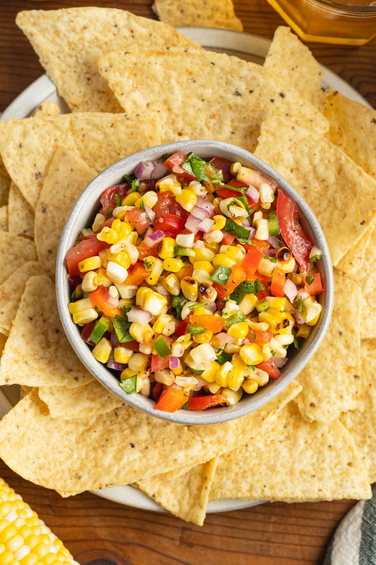 This a picture of a bowl of corn pico de Gallo.