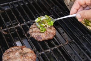 This is a picture of the veggies being added to the patty.
