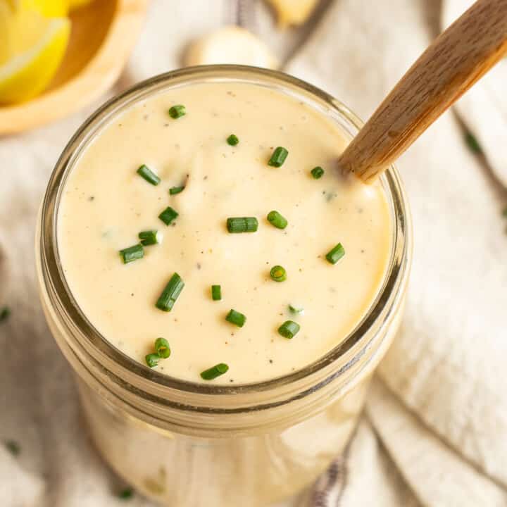 This is a square picture of a jar of smoked garlic sauce.