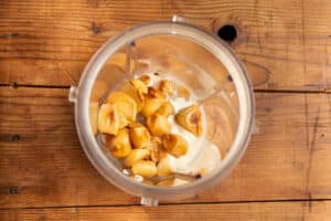 This is a picture of a blender with the ingredients for the sauce before blending.