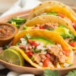 This is a picture of a plate of bean and cheese tacos.