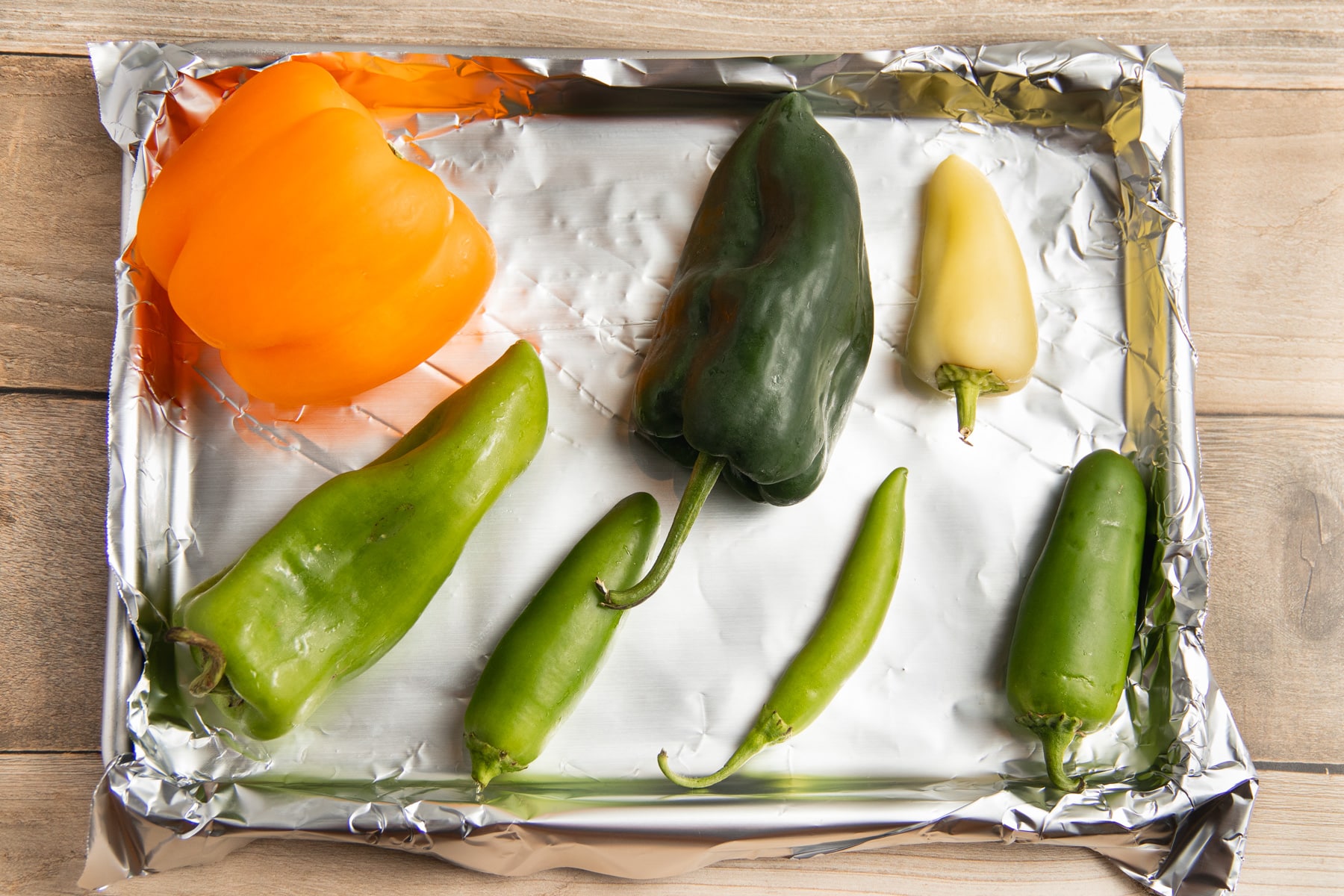 This is a picture of the peppers on a baking sheet.