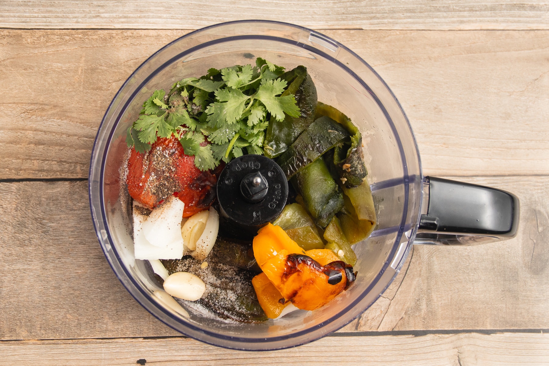 This is a picture of the peppers in the food processor before blending.