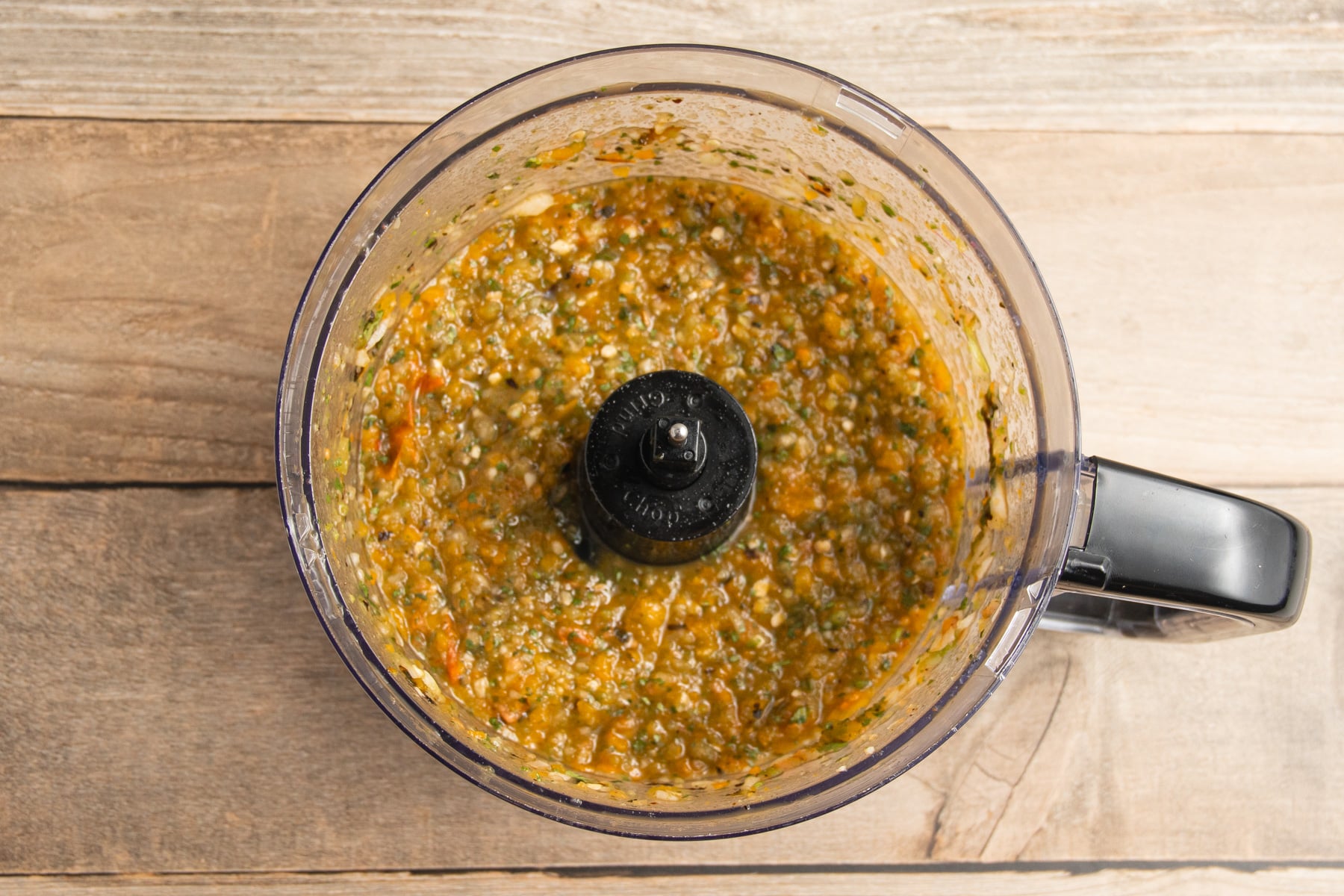 This is a picture of the peppers in the food processor after blending