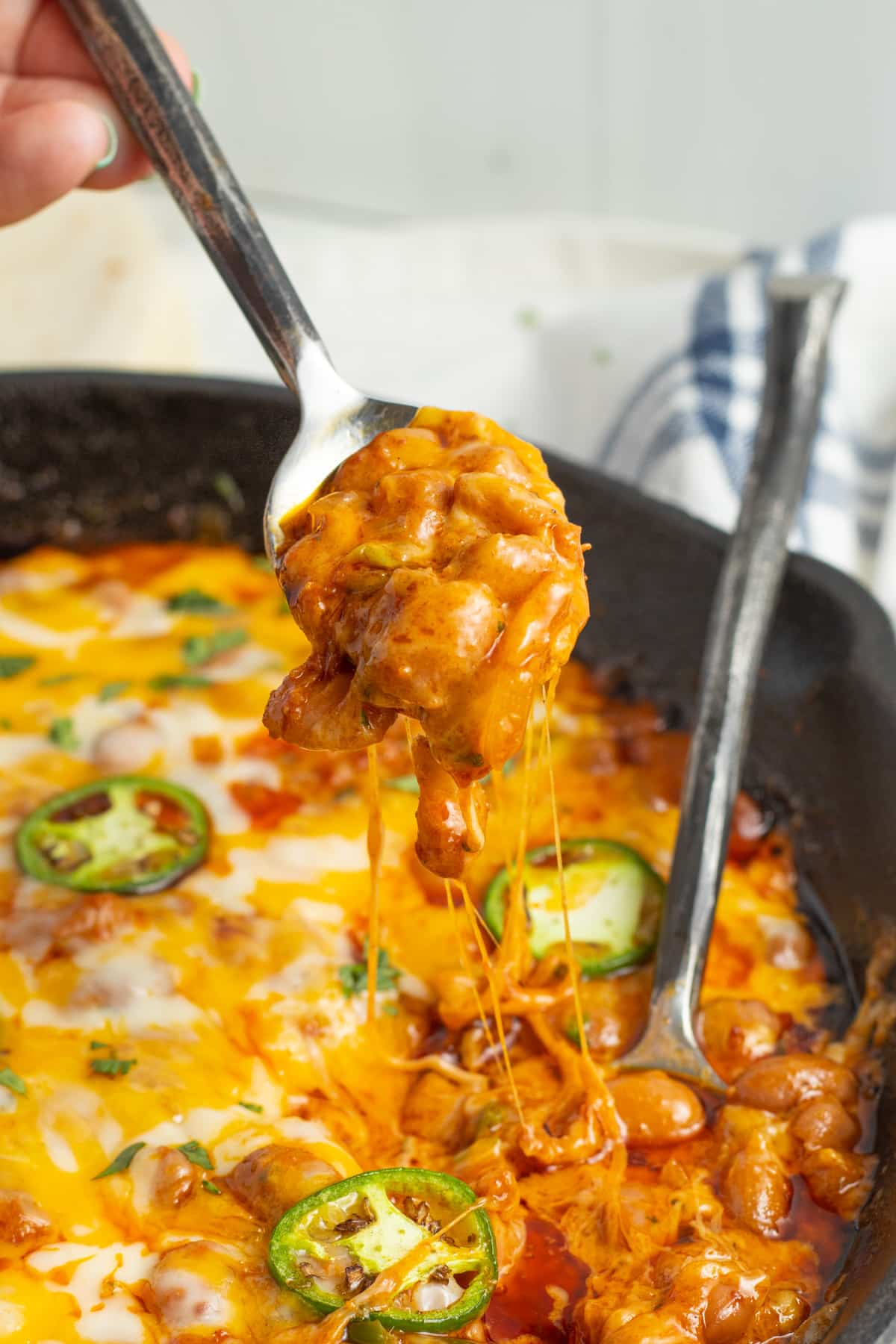 This is a picture of a skillet with chorizo and beans.