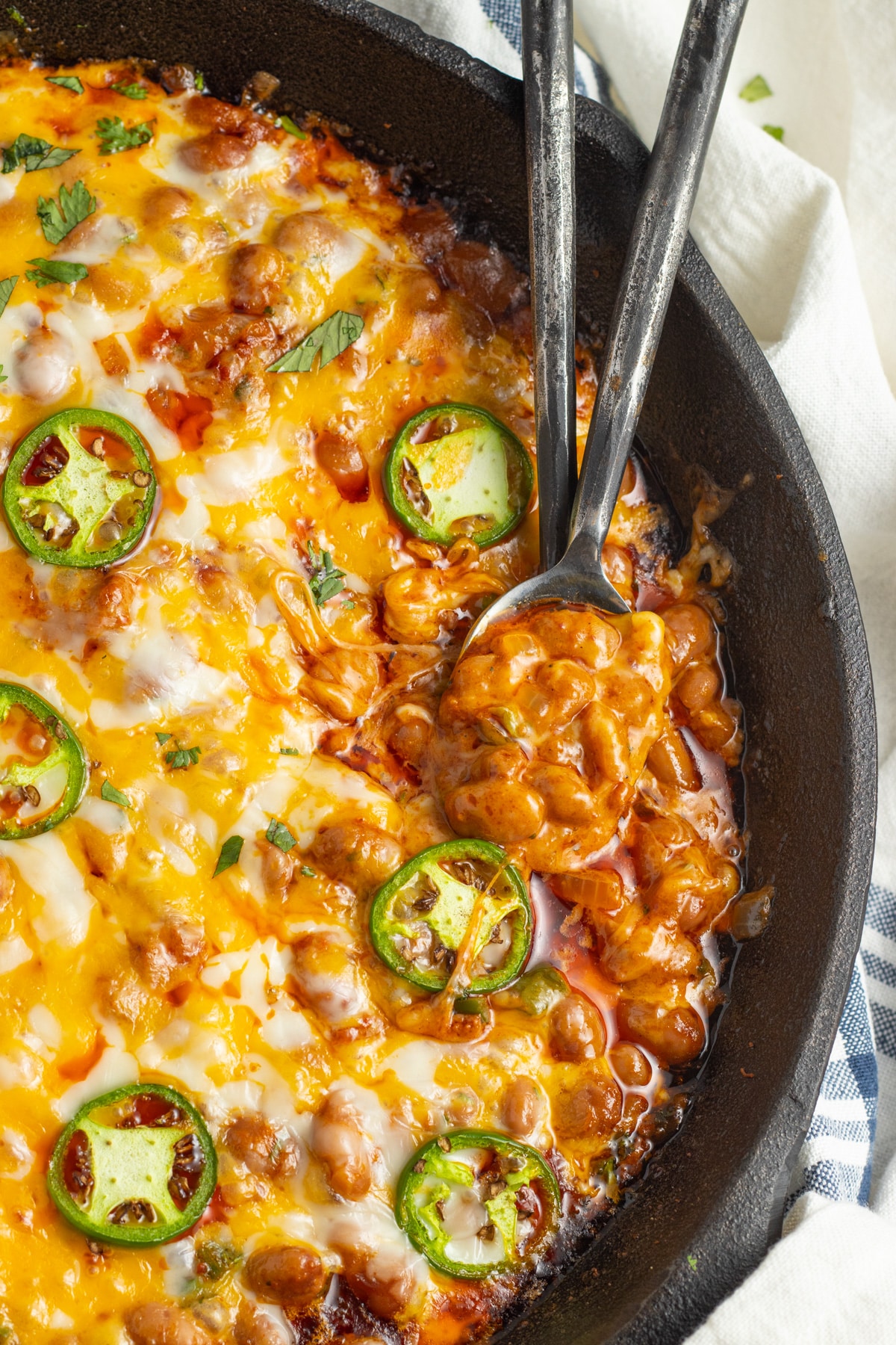 This is a picture of a skillet with chorizo and beans.