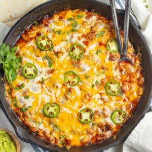 This is a picture of a skillet with chorizo and beans.