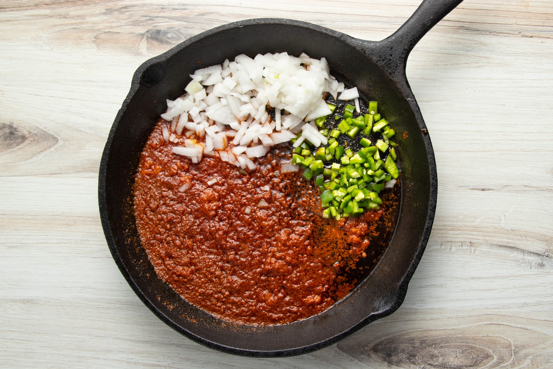 This is a picture of the chorizo onion and jalapeño in a skillet.