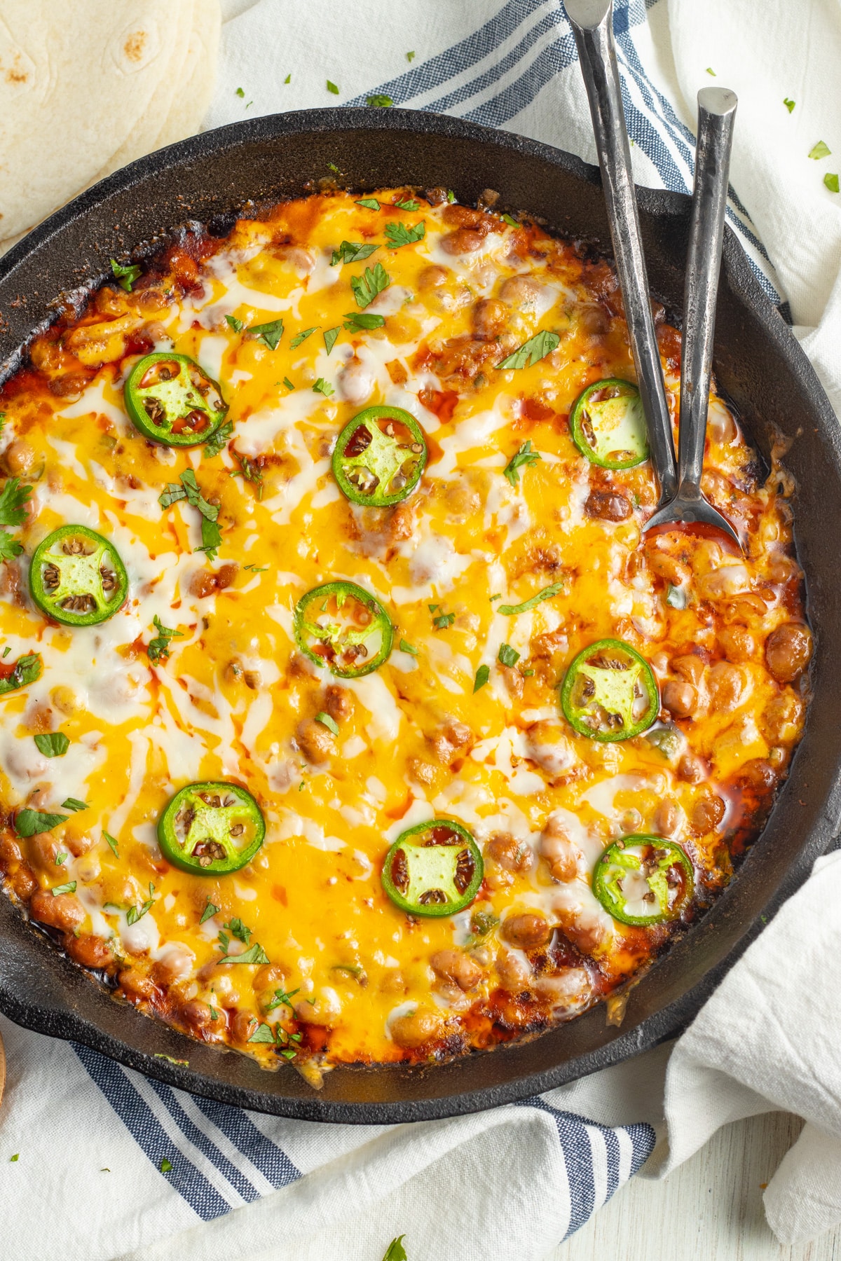 This is a picture of a skillet with chorizo and beans.
